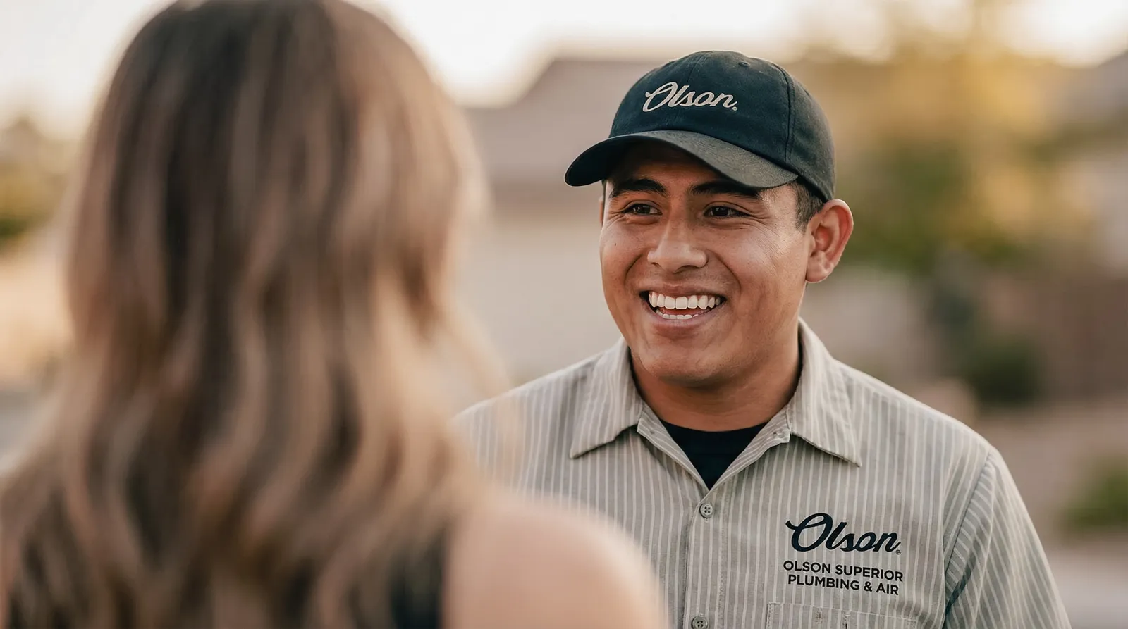 Plumber discussing upfront pricing options with a homeowner