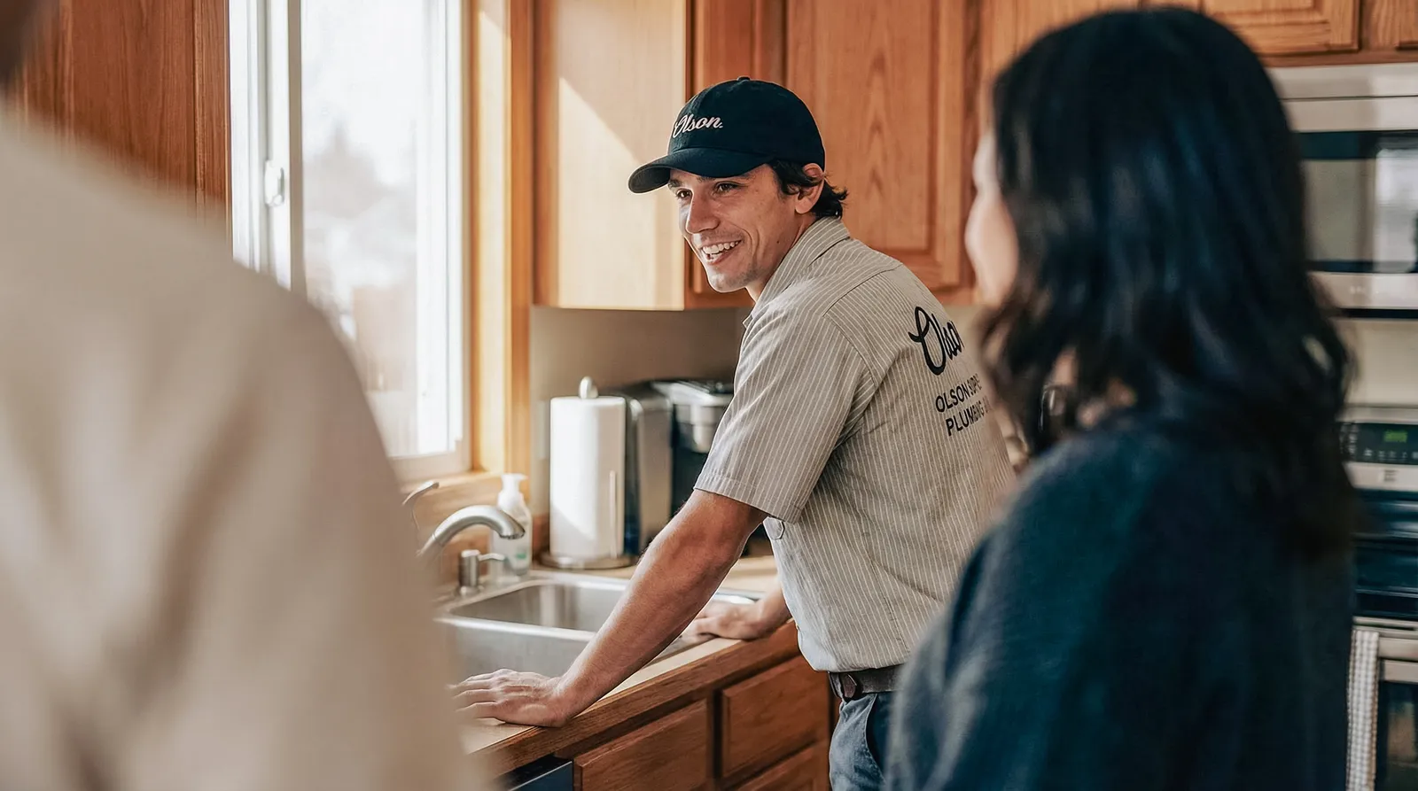 Plumber respectfully greeting a homeowner at their front door